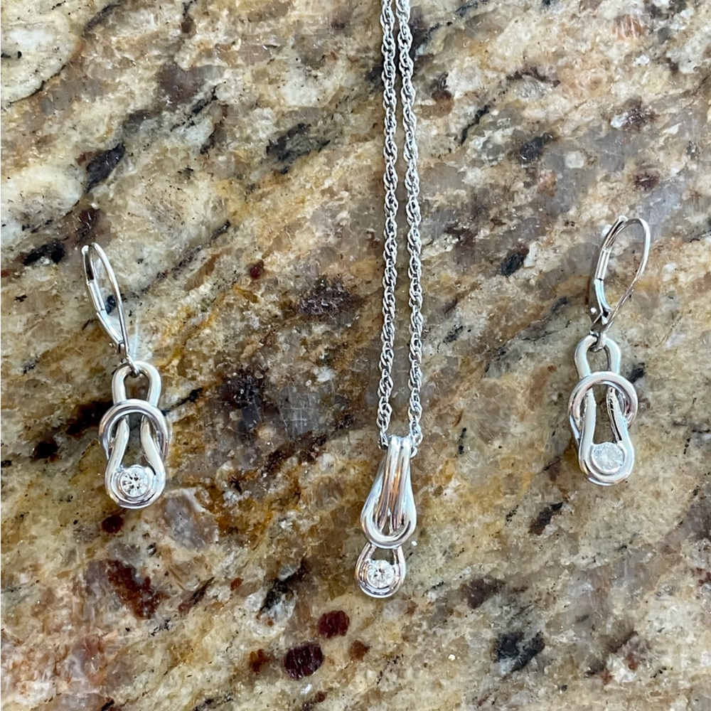 14 carrot white gold diamond necklace and earrings.